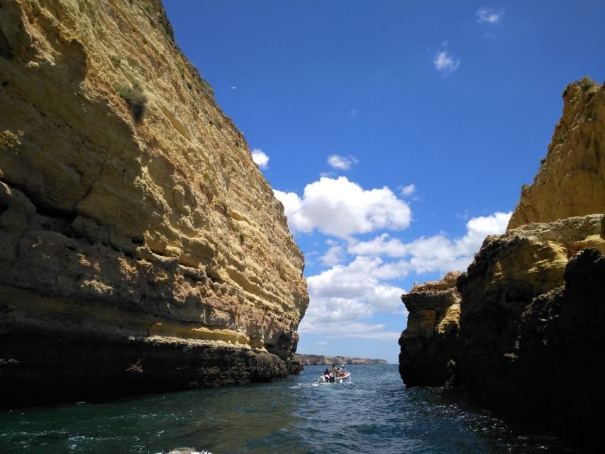 From Portimão: Benagil Caves Guided Speedboat Tour - Inside Benagil Cave: sunlight on sand, plus the no-swim rule