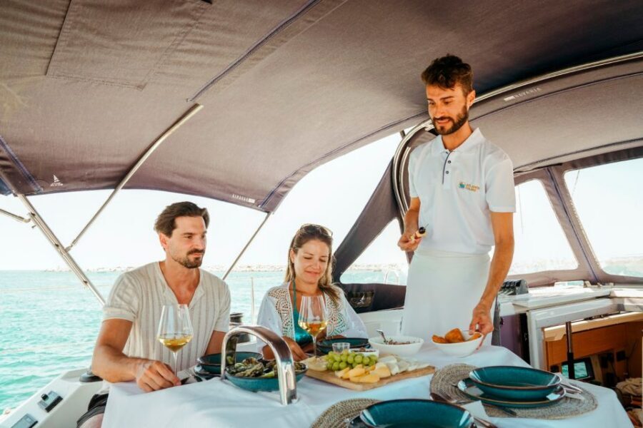 Portimao: Sunrise Luxury Sail-Yacht Cruise - The Algarve coastline cruise: golden cliffs, rock formations, and calm deck time